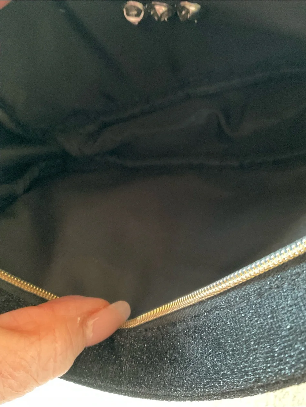 CHANEL Black Cosmetic Pouch with Gold Logo and Camellia Accents